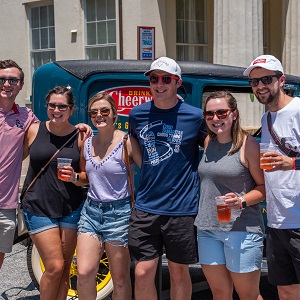 Group of People Holding Beers Posing For picture